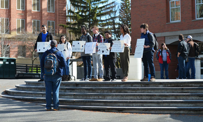 Students gather on the Todd Steps as a vigil in honor of three young African-American men killed last week in Indiana. Members of the Muslim Student Association also held the event to educate the public on challenges Muslims face.