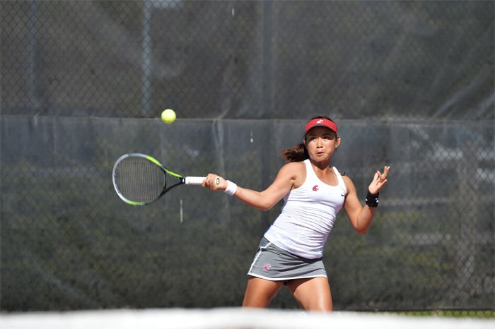 Senior+Trang+Huynh+returns+a+forehand+during+the+WSU+Invitational+at+the+Outdoor+Tennis+Courts+on+Oct.+4.