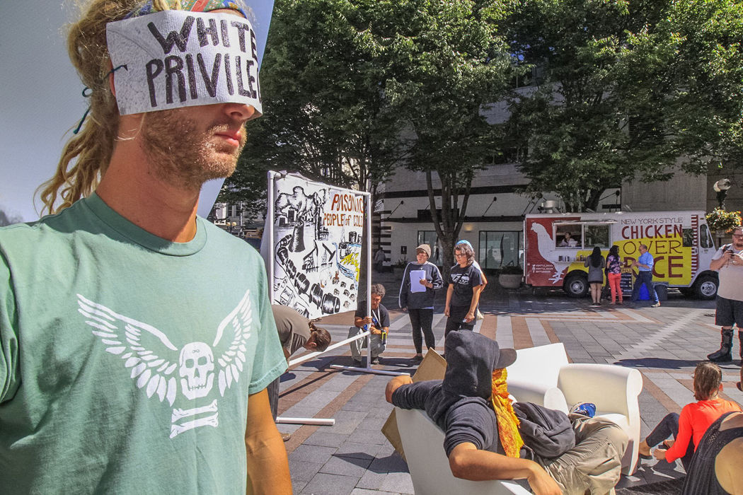A protester participates in an interactive demonstration against racism in Westlake Park in Seattle on August 17.