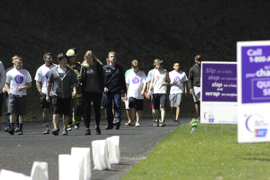 Relay+for+Life+participants+walk+the+track+at+Pullman+High+School+on+Saturday+night+to+raise+funds+for+cancer+search.
