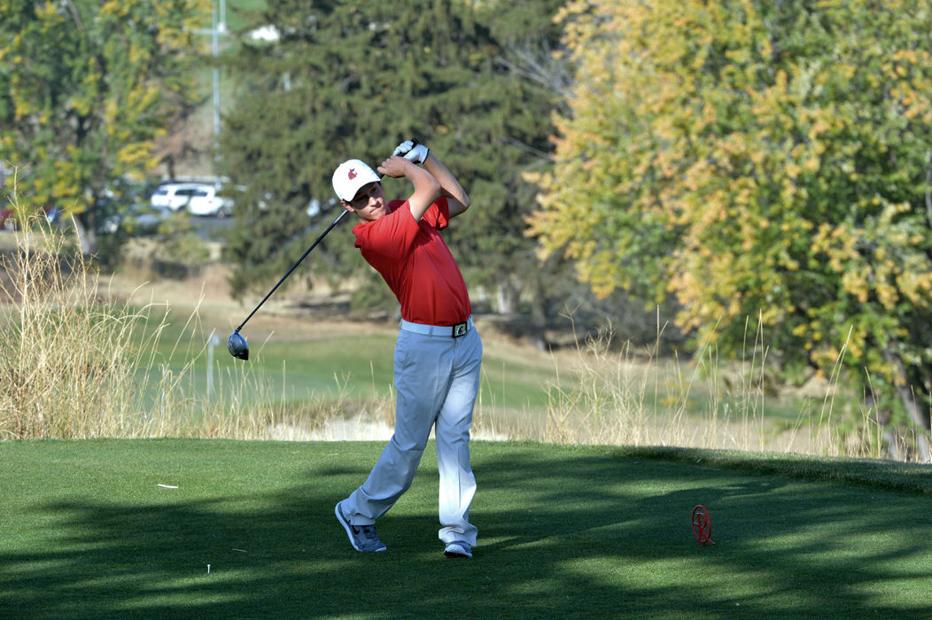 Freshman Austin Brown tees off during the Itani Quality Homes Collegiate at Palouse Ridge Golf Course on Sept. 29.