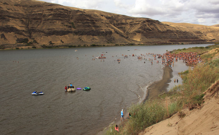 WSU students gather in fall 2014 at the Illia Dunes, a popular party spot. The dunes have been shut down on multiple occasions due to the negative environmental impact of students on the site.