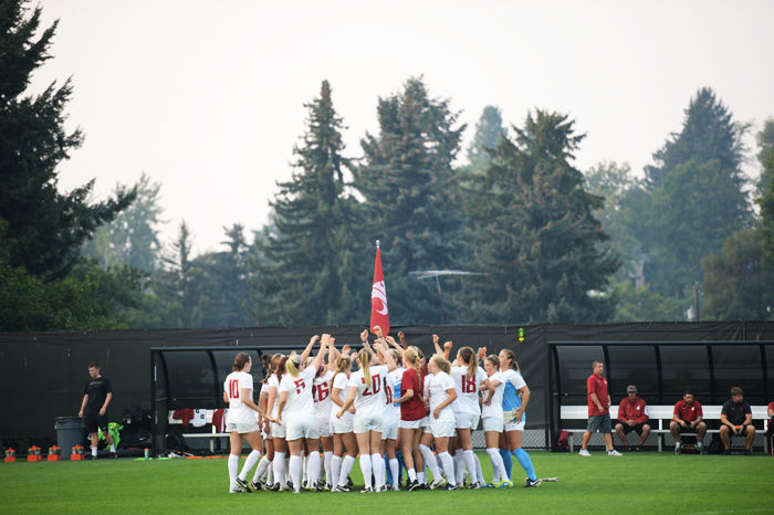 WSU women’s soccer team in a pregame huddle at its home field before a match against the University of Idaho on Aug. 24, 2015.