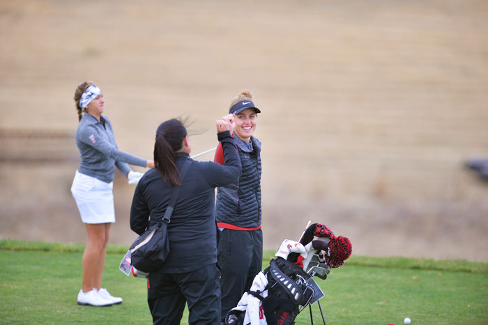 Junior Alivia Brown fist bumps at the Cougar Cup on Sept. 19. Brown took second place at the Golfweek Conference Challenge yesterday.