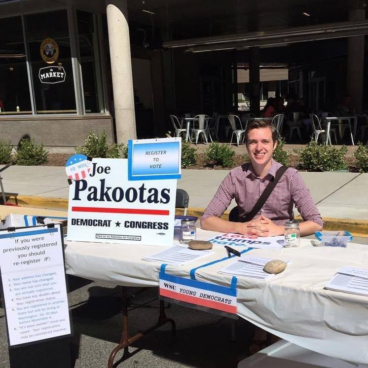 Gavin Pielow, president of the Young Democrats, tables in support of Joe Pakootas, a Democratic candidate running to represent Washingtons fifth Congressional district. 
