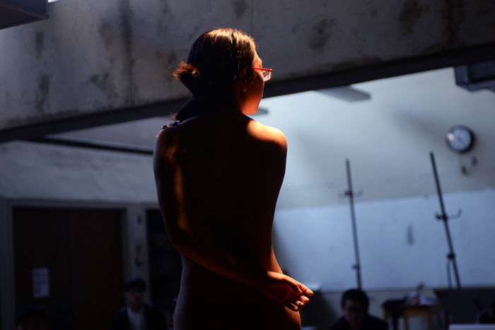 Huizi Li, an international student from China, works as a nude model for WSU art students. 