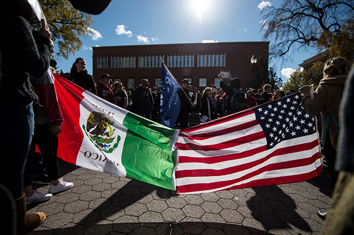 Students+seen+holding+conjoined+United+States+and+Mexico+country+flags%2C+representing+the+unity+desired+between+the+two+countries+and+the+opposition+to+Donald+Trump%E2%80%99s+strict+immigration+propositions.
