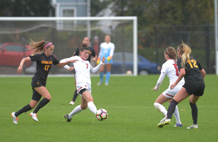 Junior midfielder Chelsea Harkins dribbles past an Arizona State defender in a match at Lower Soccer Field on Oct. 9.