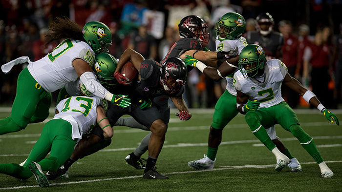 Freshman+wide+receiver+Isaiah+Johnson-Mack+breaks+through+Oregon+defenders+tackles+in+its+game+on+Oct.+1.