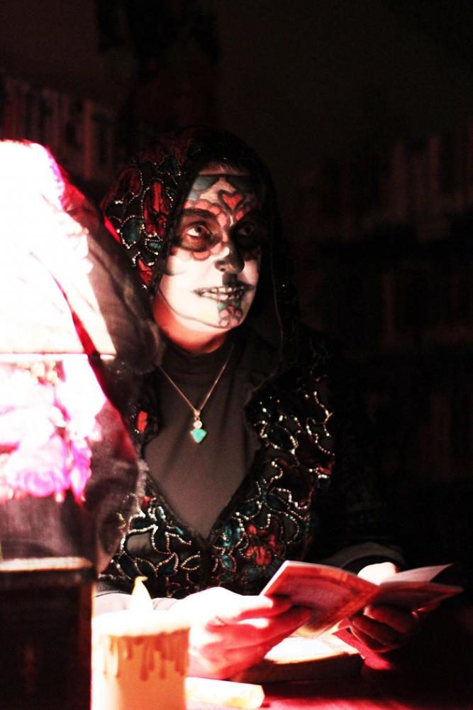 Fortuneteller Heather Walker interprets angel cards for attendees of the annual Haunted Palouse.