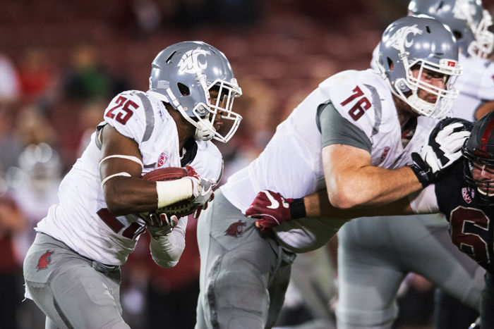WSU redshirt junior running back Jamal Morrow carries behind redshirt junior left guard Cody O’Connell against Stanford. The Cougars ran for 120 yards on 30 attempts.