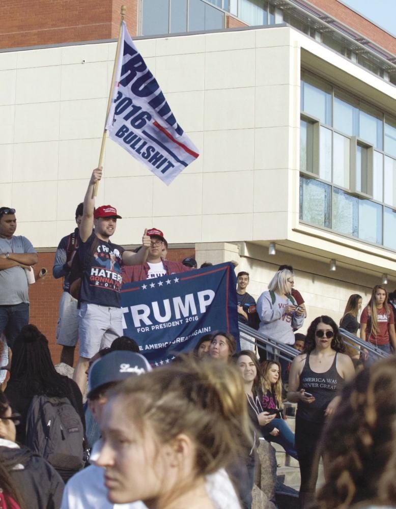 College+Republicans+President+James+Allsup+waves+a+Trump+flag+in+celebration+of+Donald+Trump%E2%80%99s+victory.