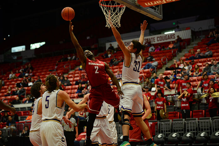 WSU senior guard Ike Iroegbu tries to draw a foul against a New Orleans Privateers defender in a 70-54 loss at Beasley Coliseum on Dec. 3.
