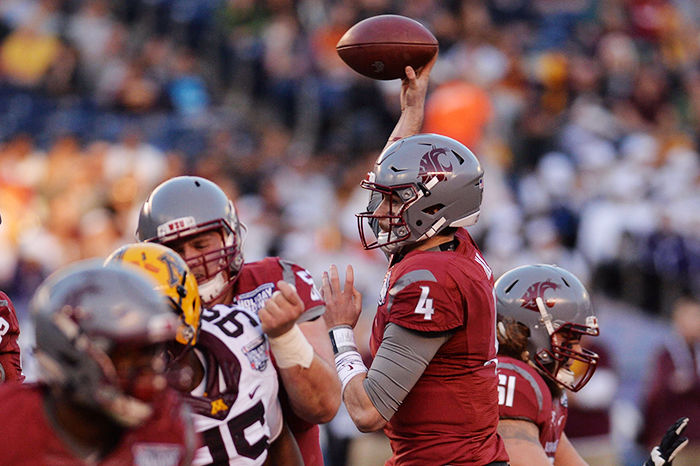 Redshirt junior quarterback Luke Falk attempts a pass against the Minnesota Golden Gophers in the Holiday Bowl on Dec. 27.