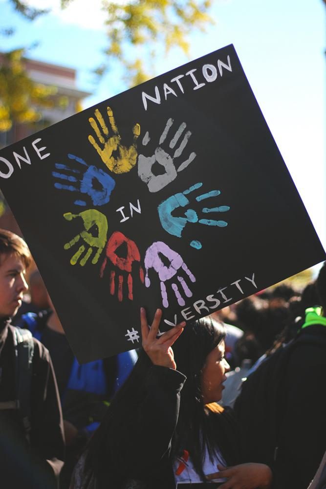 A sign at the Trump wall protest on Oct. 19 reads “One Nation in #Diversity.”
