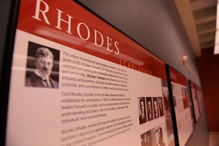 A plaque describing the Rhodes scholarship hangs on the ground floor of the CUB near the library entrance.