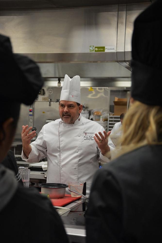 Jamie Callison, the executive chef at the Marriott Foundation Hospitality Teaching Center, demonstrates a sushi recipe to his students on Wednesday.