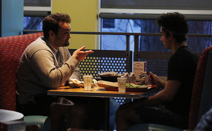 Students Ben Retzlaff, left, and Jeremy Sawyer eat at Northside Cafe on Wednesday.