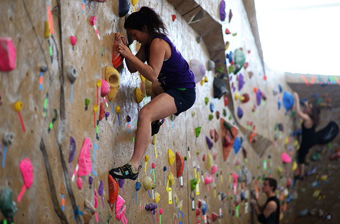 Teresa Wang climbs during the first heat of the Bouldering Competition on Saturday at the University Recreation Center.