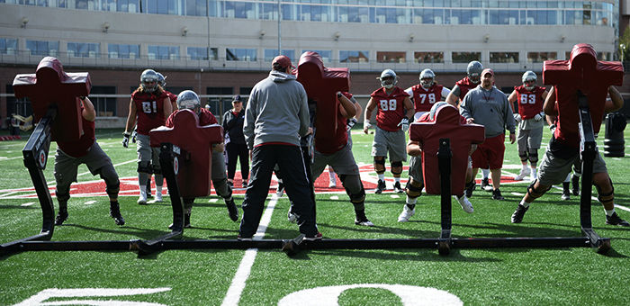 The WSU offensive linemen practice blocking techniques on March 23.