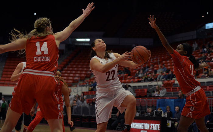 Junior guard Pinelopi Pavlopoulou drives through two Utah defenders on her way to the basket on Feb. 23.