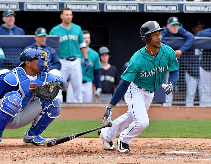 Mariners’ Jarrod Dyson heads to first after hitting a single in Spring Training. 
