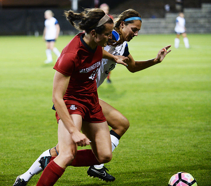 Former+WSU+soccer+forward+Amy+Neal+dribbles+the+ball+past+a+Brigham+Young+University+defender+in+a+2-1+double+overtime+loss+on+Aug.+19+at+Lower+Soccer+Field.