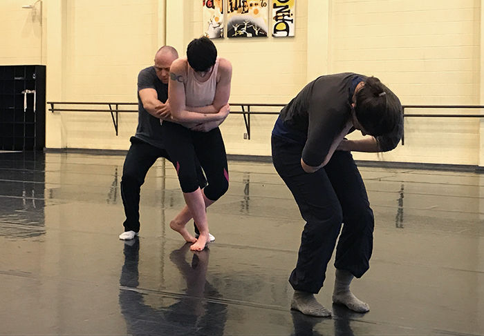Natalie Greenfield and Wesley Petersen rehearsing their contemporary dance duet with their choreographer Belle Baggs, right, a faculty member with the UI Dance Program.