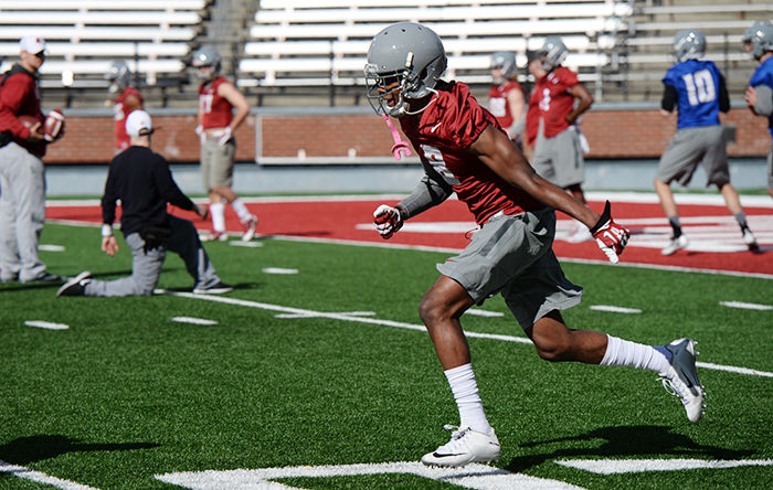 Early freshman enrollee Anthony White Jr. runs routes with other wide receivers and quarterbacks during practice on March 22.