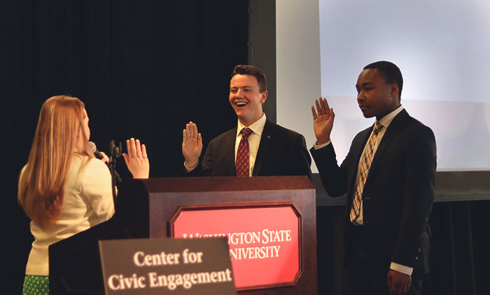 ASWSU Chief Justice Eden Kelshaw swears in ASWSU President Jordan Frost and Vice President Garret Kalt during the LEAD ceremony Tuesday night in the CUB Senior Ballroom.
