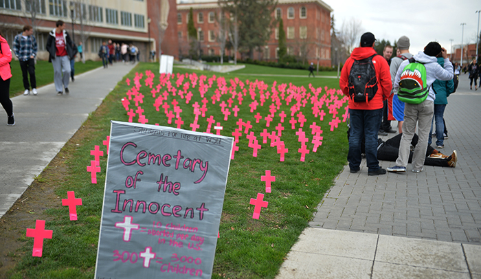 Students for Life’s demonstration between Bryan Hall and Holland Library on Wednesday featured pink crosses to represent aborted fetuses.
