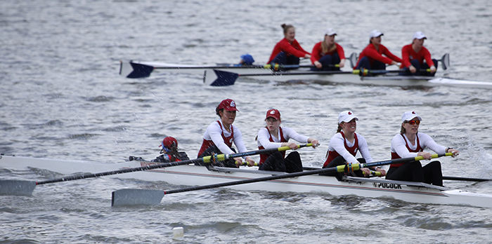 WSU women’s varsity rowing team attempts to beat Gonzaga in a race at the Snake River on March 25.