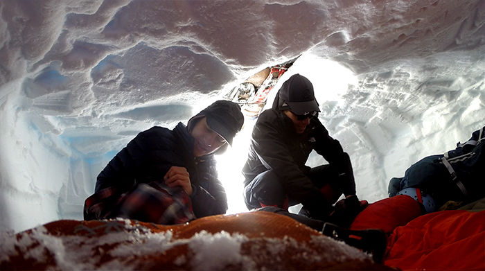 Ryan+Pugh%2C+left%2C+and+Cyrian+Zanchero+grab+gear+from+inside+the+snow+cave+they+built+during+an+ORC+trip+to+Mount+Rainier.%C2%A0