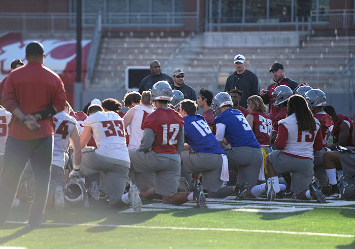 WSU assistant coaches address the football team after the first spring practice on March 23.