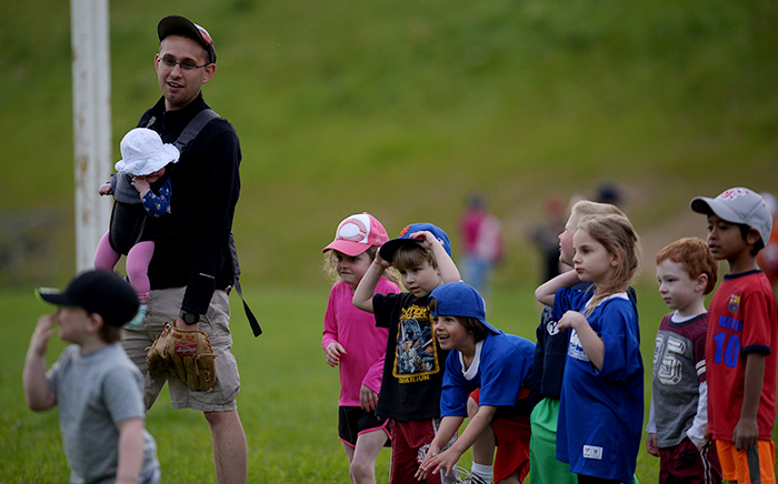 Joel McDaid, WSU graduate student and Pullman Parks and Recreation coach, oversees his youth team during the first day of the T-ball session May 15 at Lincoln Middle School.