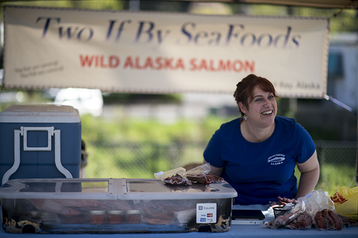 Shannon Ford talks to other vendors and shoppers while selling Alaskan seafood at the Pullman Farmers Market on May 10.