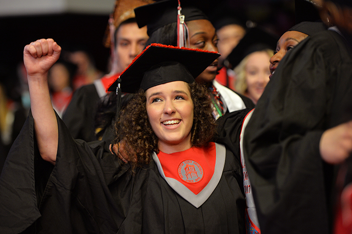 Allison+Borgida+walks+with+other+graduates+across+the+stage+during+commencement+at+3+p.m.+on+May+6+at+Beasley+Coliseum.