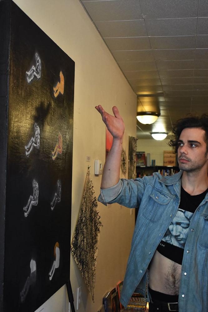 Mixed-media artist Nathan Austin discussing his work Few of Days, Full of Trouble on display Friday at Palouse Books.