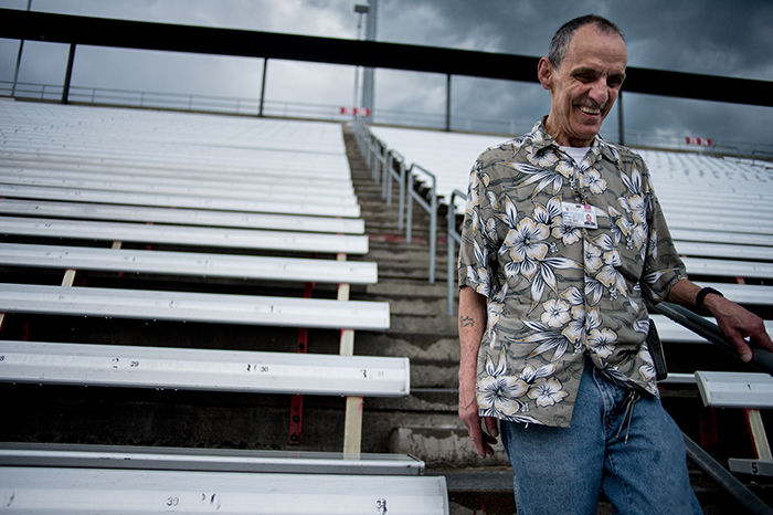 Custodian+Supervisor+John+Berney+walks+down+concrete+stairs+near+the+student+section+bleachers+at+Martin+Stadium+on+Monday.+Berney+talks+about+his+cleaning+experiences+before%2C+during+and+after+home+games.