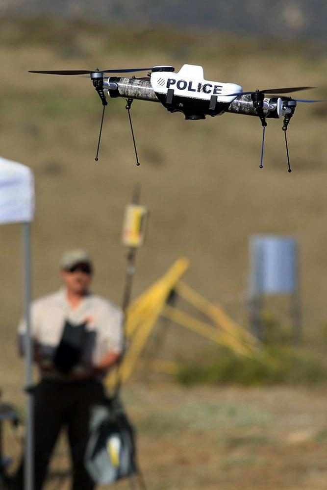 Nowell Siegel, a flight test pilot, helps guide the Qube, a police drone Oct. 19, 2011 in Simi Valley, California. 