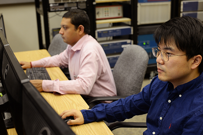 Researcher Param Banerjee and graduate student Hyojong Lee work on a modeling project Monday in a lab WSU will use to validate algorithms for the project.