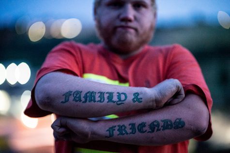 Blaize Reeves shows his tattoos reading family and friends, the most important words in their family.