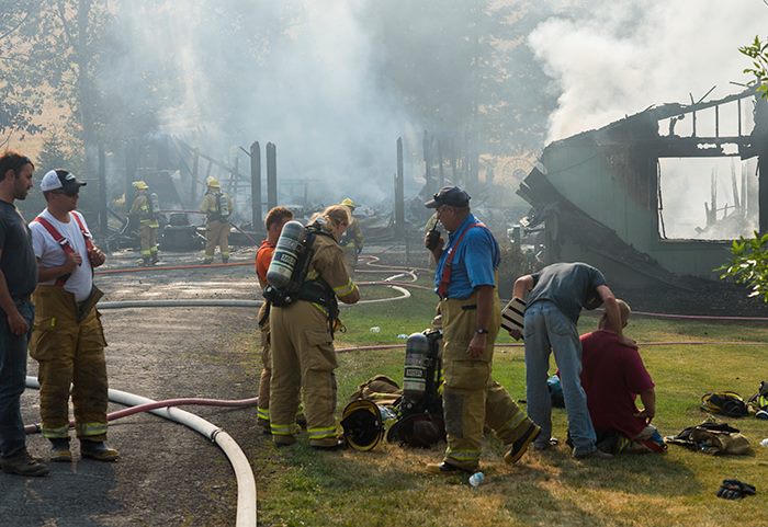 Smoke billows from the house that caught fire Tuesday afternoon near the intersection of Barbee and Wilbourn Road. No one was home at the time of the fire, but two dogs are presumed dead.