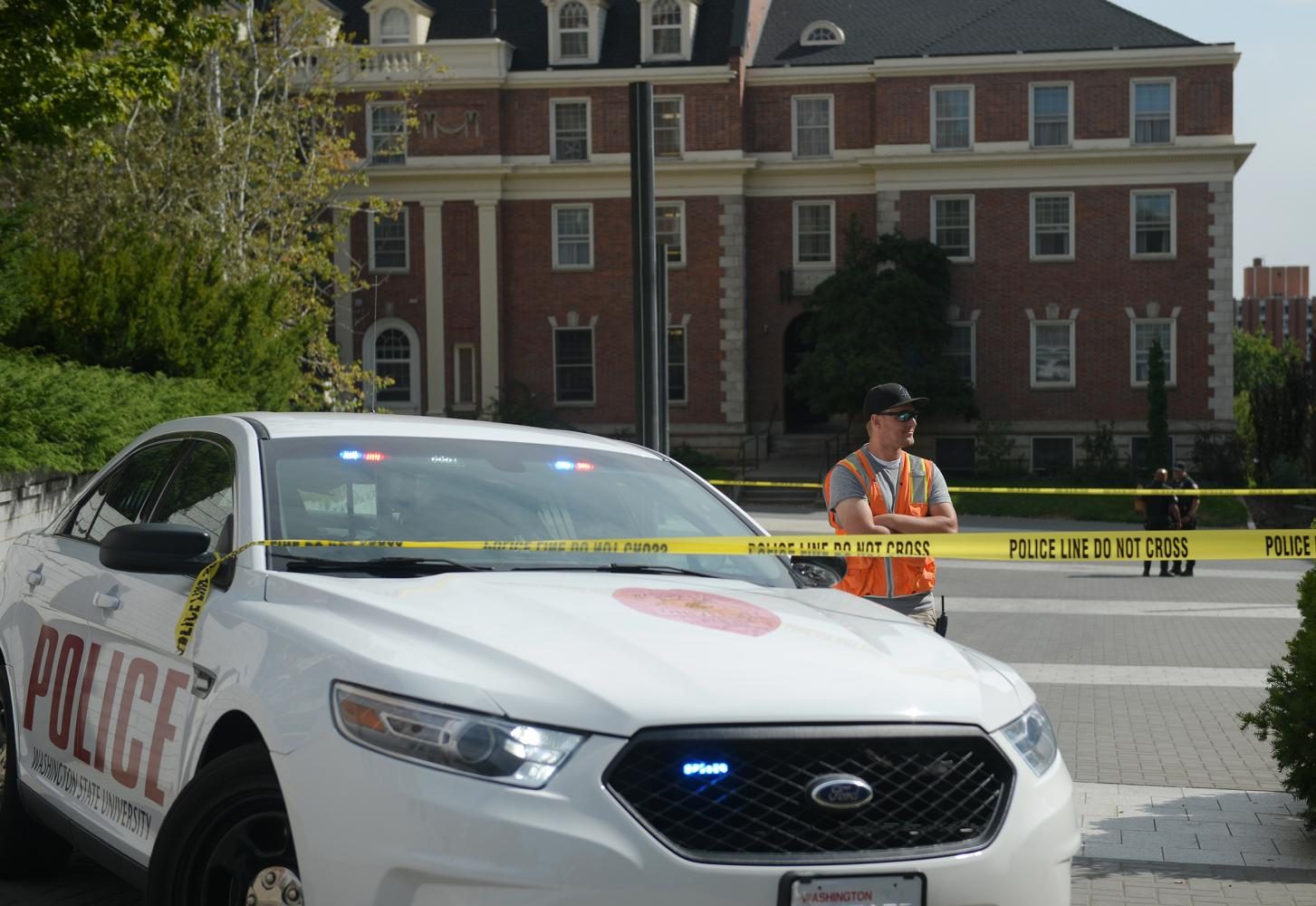A WSU police car parked outside Stimson Hall, which was evacuated and cordoned off following the second bomb threat to the building in three days.
