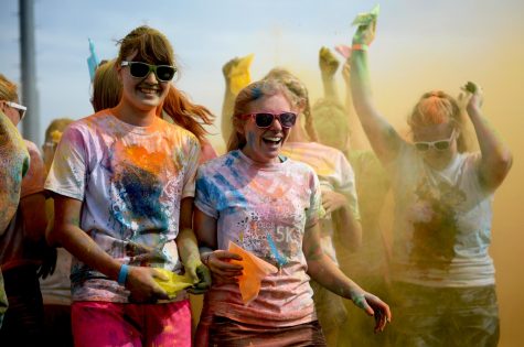 The Color Me Coug 5K is an annual race during which runners get covered with colored powder. 
