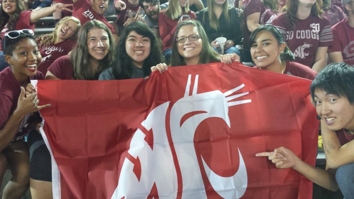 Mint editor Jennifer Ladwig, second from left, at a WSU football game on Sept. 20, 2014. The best photo bomb in history. Go Cougs.