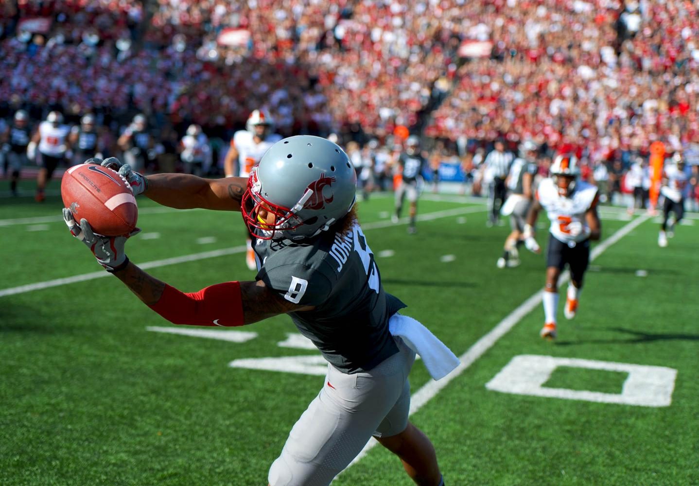 Sophomore wide receiver Isaiah Johnson-Mack catches a pass on the sidelines for a gain of yards against Oregon State on Saturday at Martin Stadium.