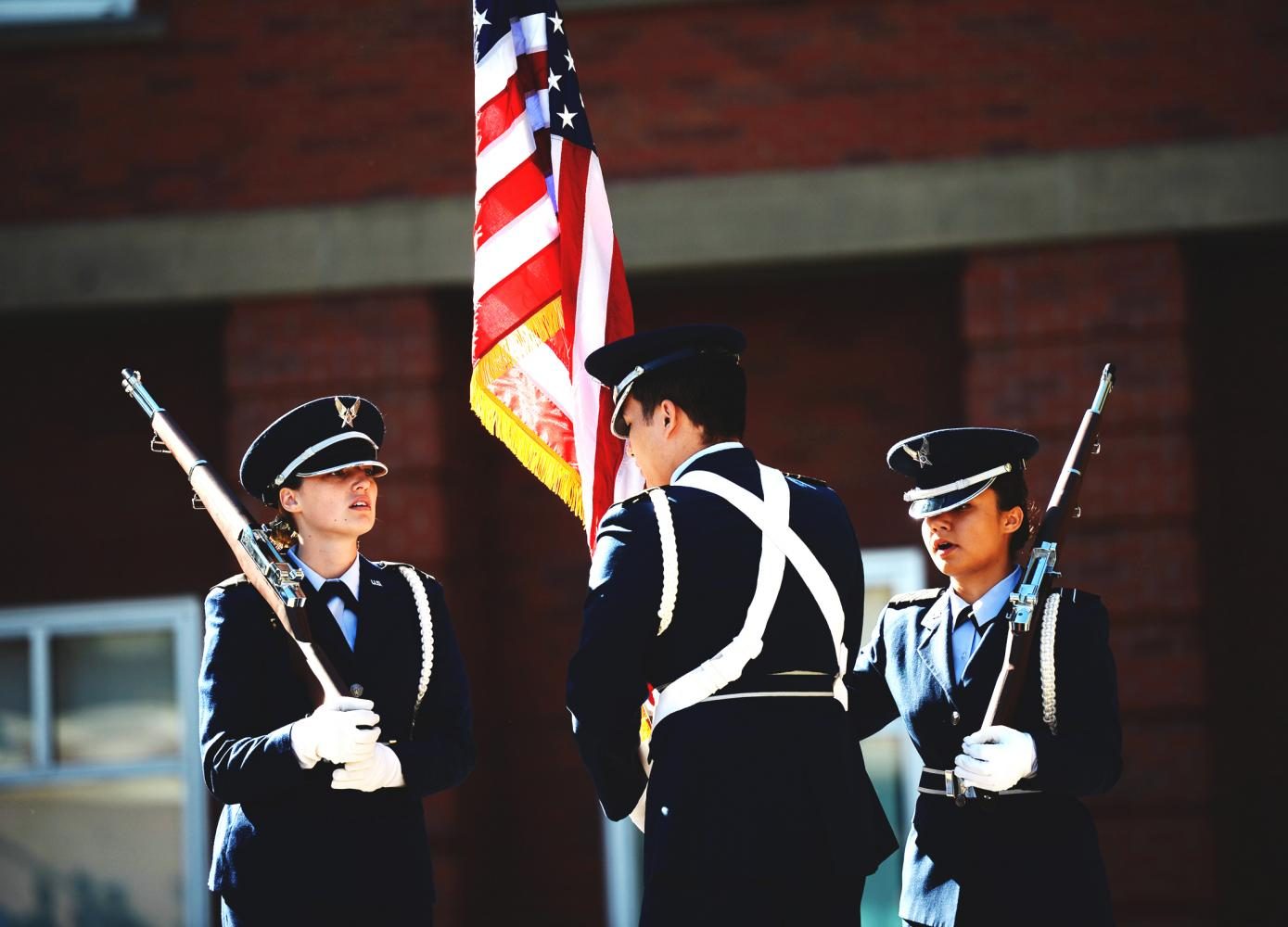 Cadet Kyanna Byrd, Ryan St. John and Lexi Fredrickson prepare for the September 11 vigil on the steps of Todd Hall Monday morning. 