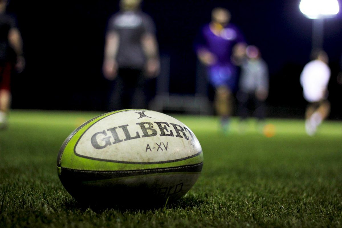 A rugby ball lays on the South Fairway Playfield turf during practice last week.