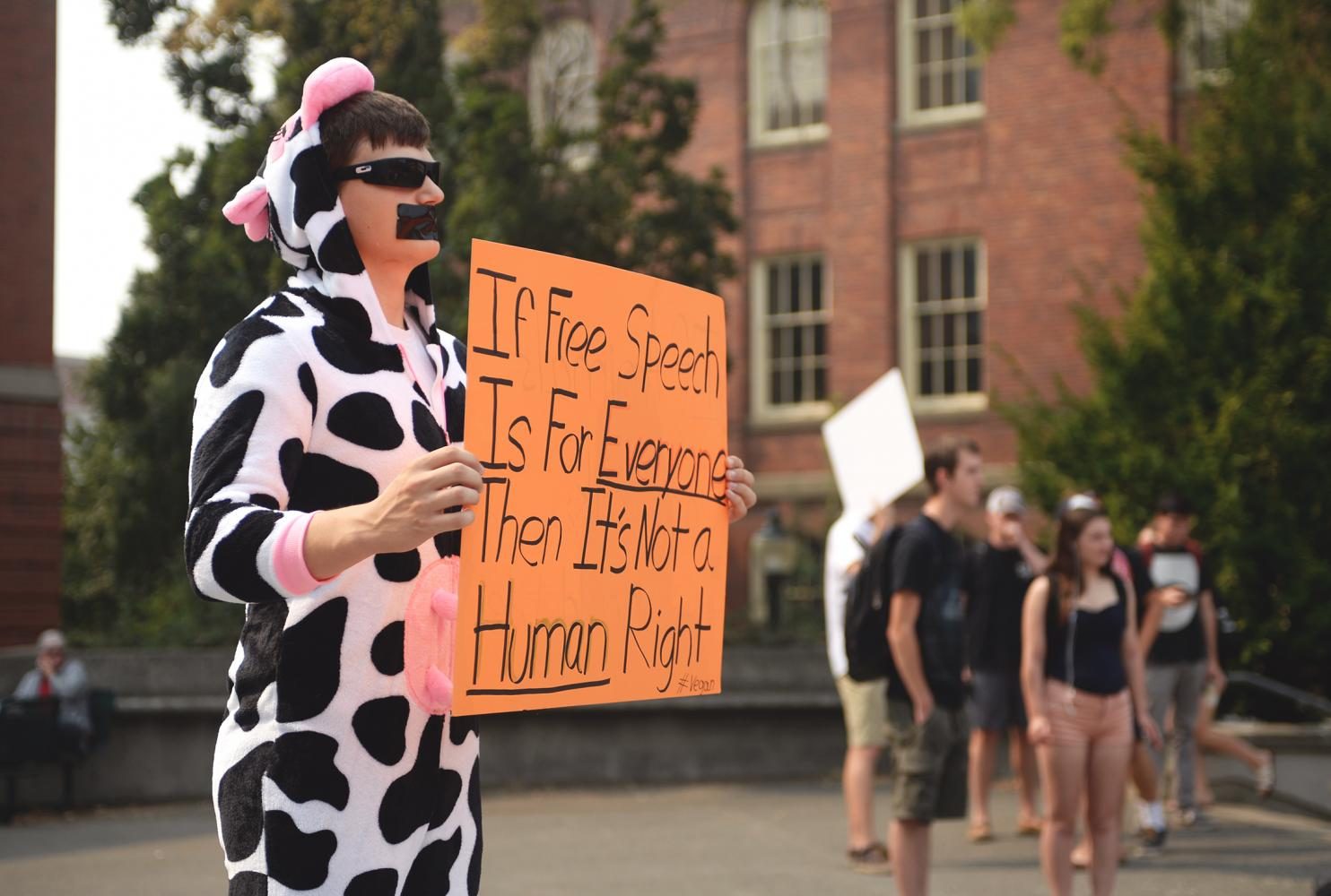 Sophomore Matt Molitor dresses in a cow suit to advocate for animal rights and veganism Wednesday.